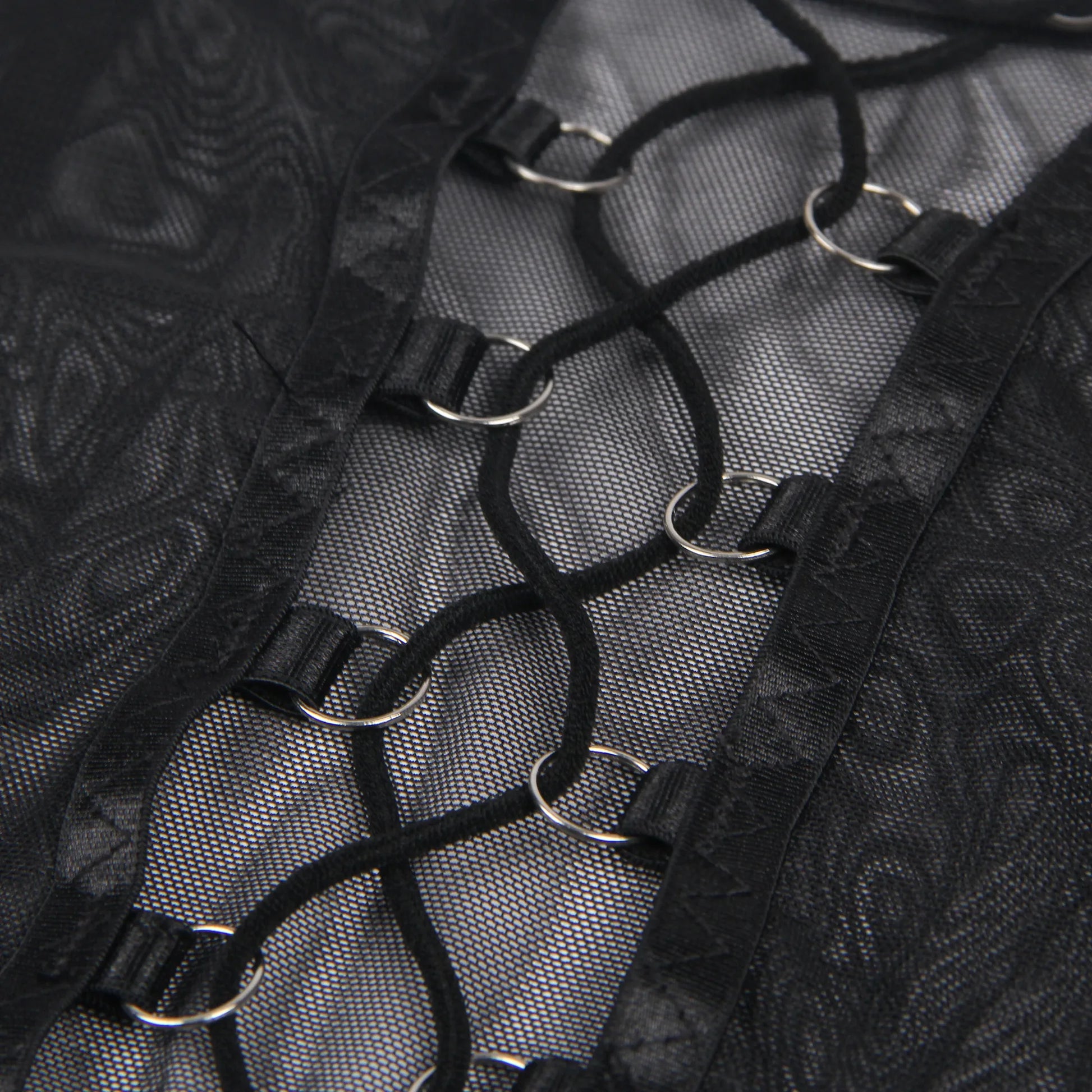 black lingerie lace up detail with metal rings and mesh fabric